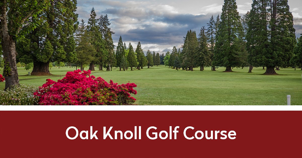 Oak Knoll Golf Course with fairway between tall pines