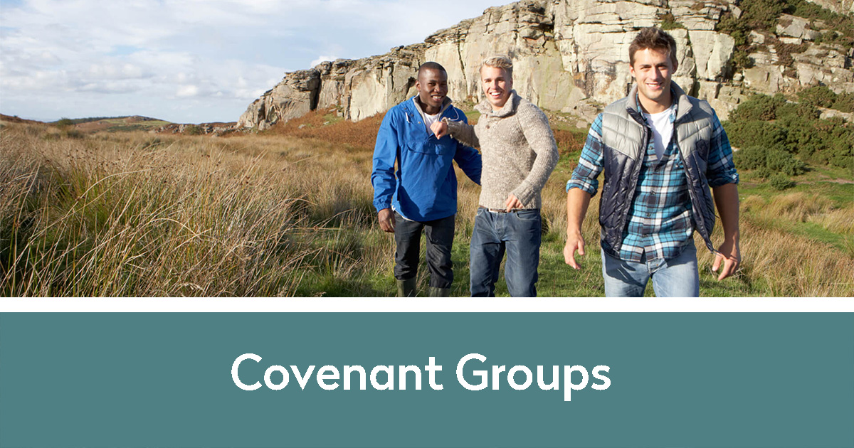 Covenant Groups | three guys laughing and walking together near mountains