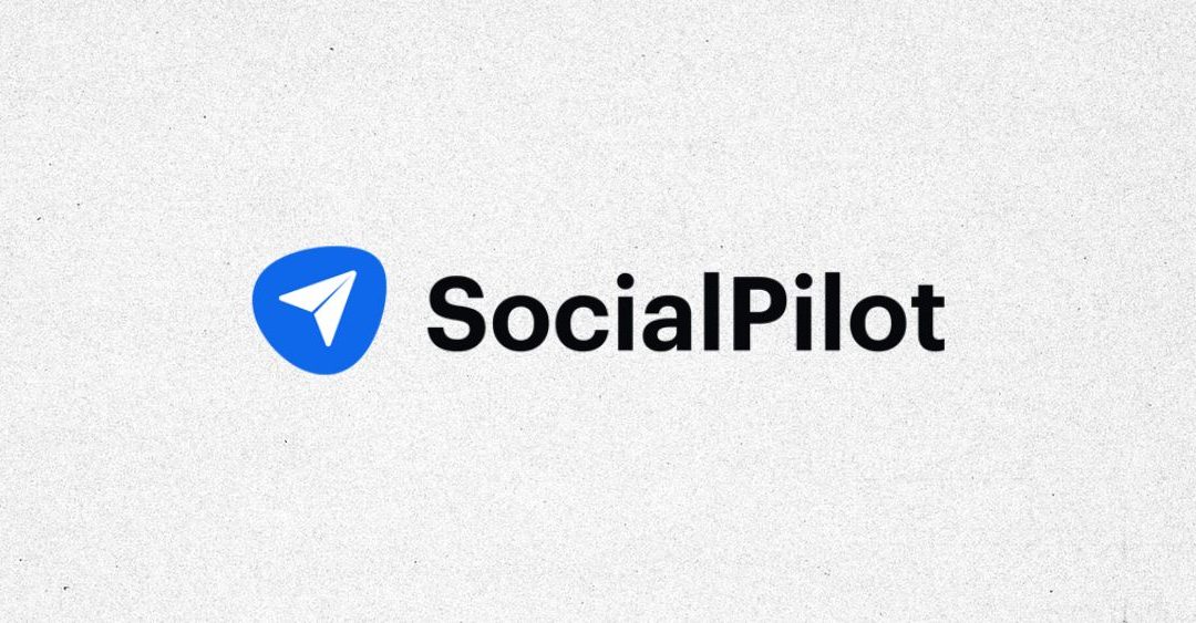 textured gray background with SocialPilot logo in black and a blue icon to the left of a paper airplane