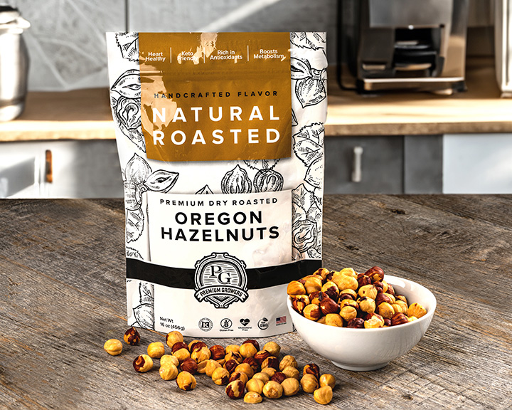 Kitchen island with Premium Growers Oregon Hazelnuts in a bowl and strewn in front of the package